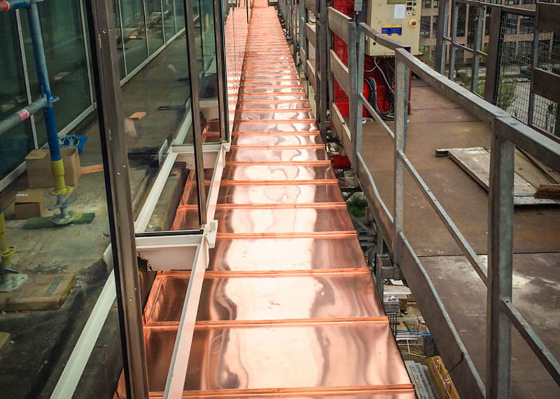 Habillage bandeau périphérique musée Eastman en cuivre naturel - Bruxelles